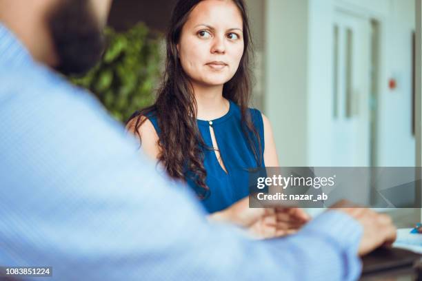 maori woman in a meeting. - new zealand maori people talking stock pictures, royalty-free photos & images