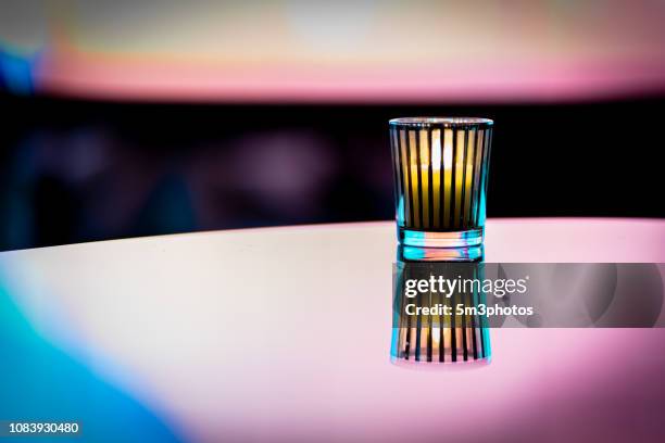 nightclub bar scene of abstract nightlife with candle and table at restaurant - food photography dark background blue stock pictures, royalty-free photos & images
