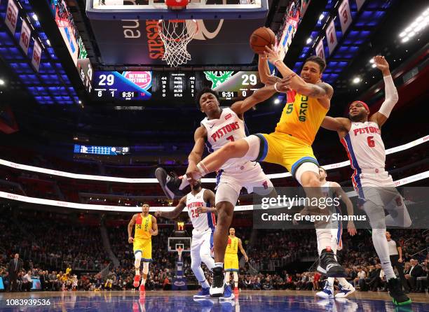 Wilson of the Milwaukee Bucks battles for the ball with Bruce Brown and Stanley Johnson of the Detroit Pistons during the first half at Little...