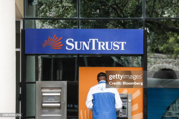 Customer uses an automatic teller machine at a SunTrust Banks Inc. Branch in St. Petersburg, Florida, U.S., on Monday, Jan. 14, 2019. SunTrust Banks...