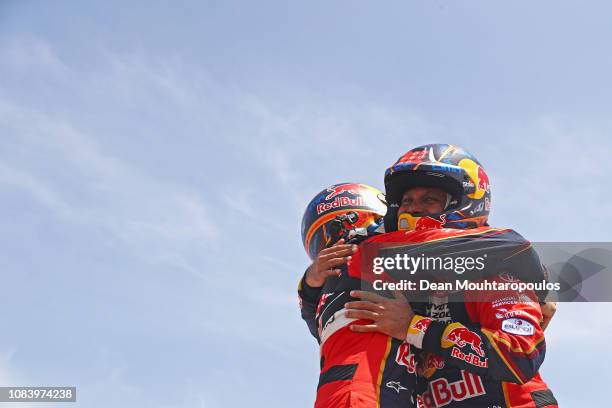 Toyota Gazoo Racing Sa no. 301 TOYOTA HILUX car driven by Nasser Al-Attiyah of Qatar and Matthieu Baumel of France celebrates as they cross the...