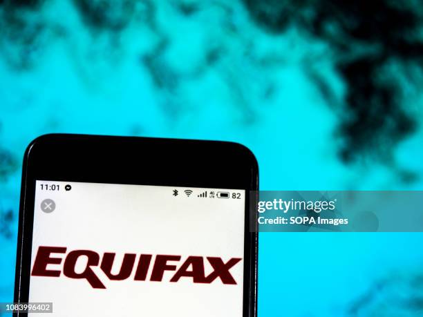 In this photo illustration, the Equifax Consumer reporting agency company logo seen displayed on a smartphone.