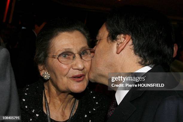 French Prime minister Francois Fillon is kissing Simone Veil in Paris, France on March 02nd , 2009.