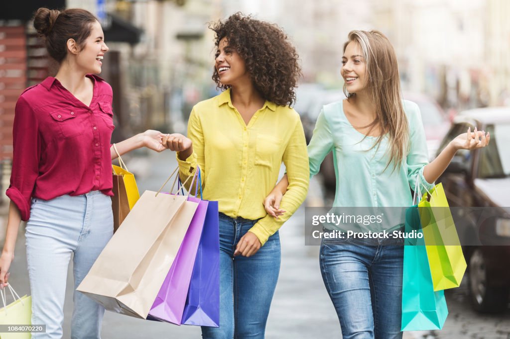 Women walking with shopping bags in the city