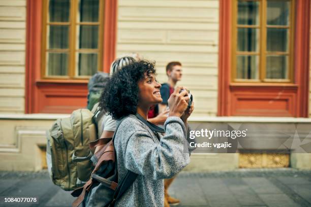 millennial's friends visit foreign city - searching bag stock pictures, royalty-free photos & images