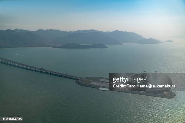 south china sea, lantau island and hong kong-zhuhai-macao bridge in hong kong daytime aerial view from airplane - lantau imagens e fotografias de stock
