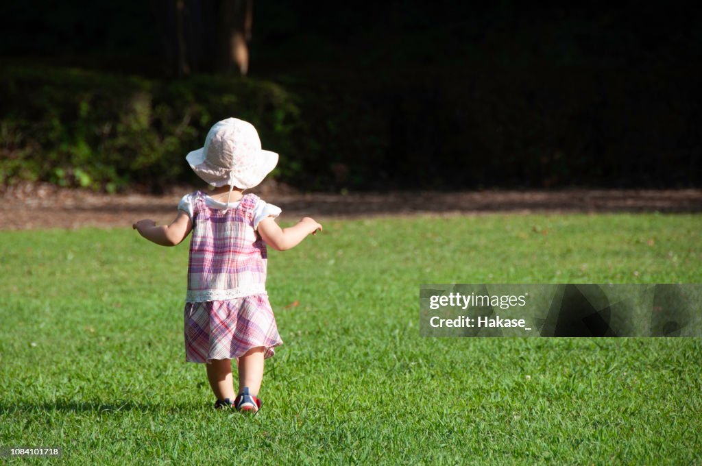 Toddler girl playing in the park