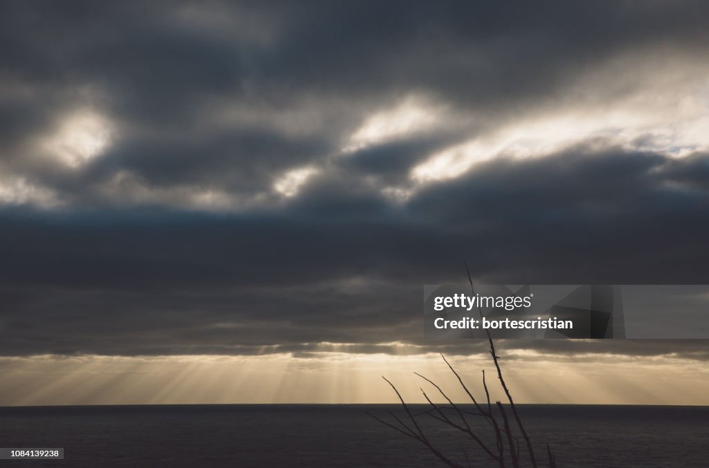 Scenic View Of Sea Against Storm Clouds