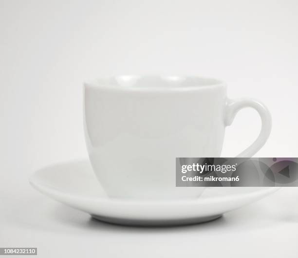 white cup with saucer isolated on white background - white cup stock pictures, royalty-free photos & images