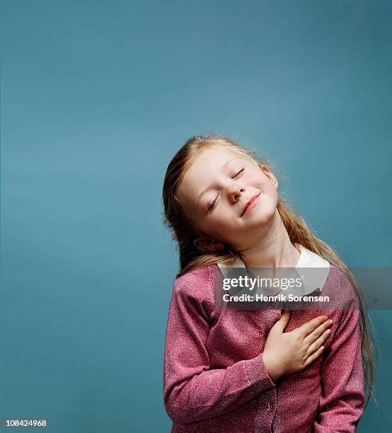 portrait of young girl pledging alliance - lojalitet bildbanksfoton och bilder