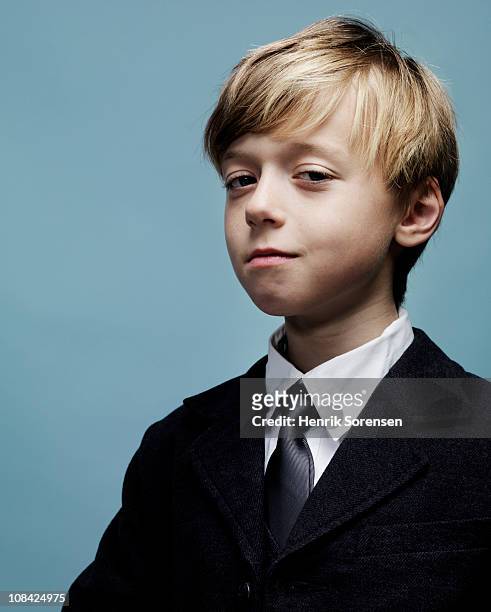 portrait of smartly dressed young boy - smug stock pictures, royalty-free photos & images