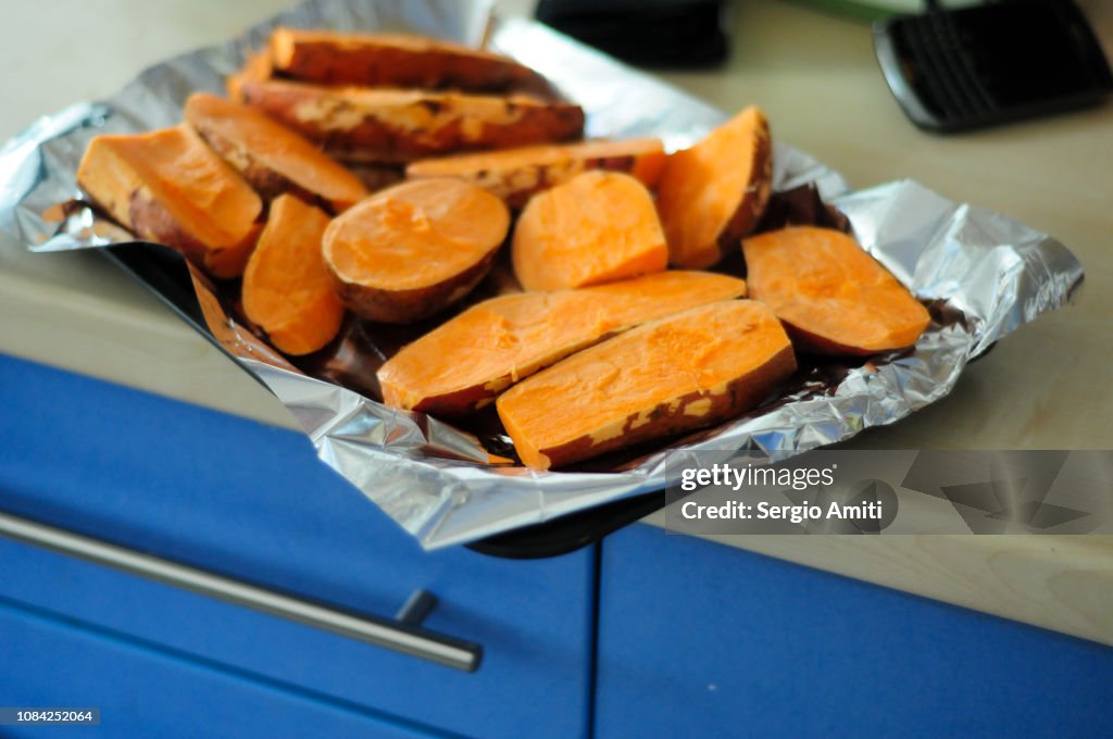 Cut sweet potatoes on a tray