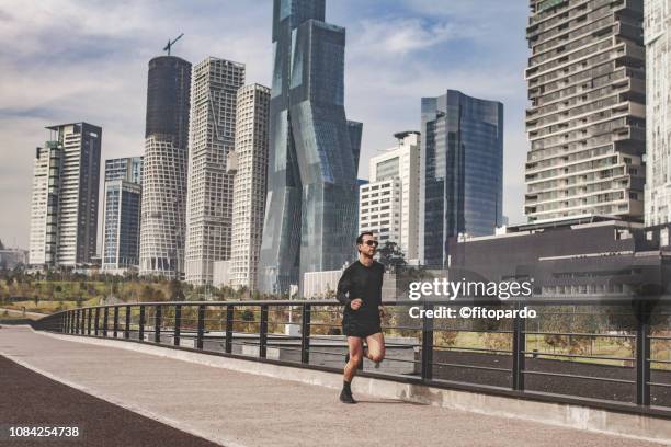 man jogging in the city - mexico skyline stock pictures, royalty-free photos & images