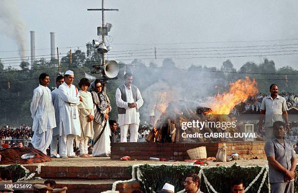 India's Premier Rajiv Gandhi , accompanied by his Italian-born wife Sonia and his daughter Priyanka and body guards, looks 03 November 1984 near New...