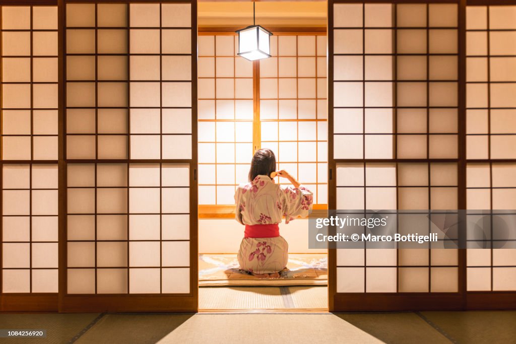 Woman brushing hairs in a traditional ryokan