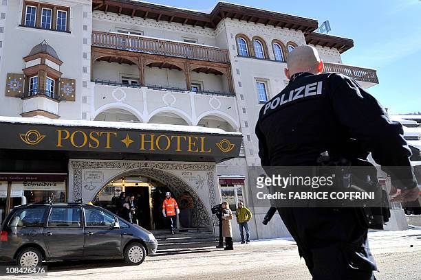 Policeman walks past the Morosani Posthotel after a "small explosion" occured at the hotel during the World Economic Forum annual meeting on January...