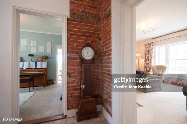 home interiors - grandfather clock stock pictures, royalty-free photos & images