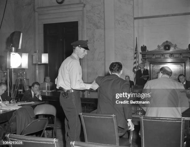 Here are two views of Henry N. Shoiket getting the heave-ho from a senate hearing room in Washington today. Shoiket was appearing before Senator...
