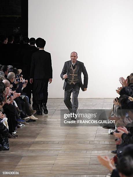 Italian designer Antonio Marras salutes the audience after the Kenzo men's fall-winter 2011-2012 ready-to-wear collection show on January 22, 2011 in...