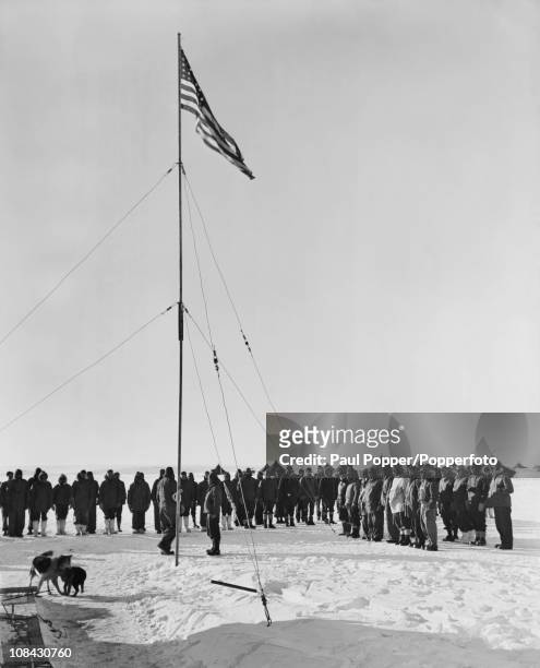 Rear Admiral Richard E Byrd addresses his men at a flag-raising ceremony at the Antarctic research base Little America IV, on the Ross Ice Shelf,...