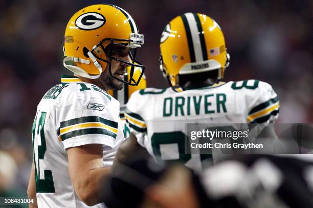 Quarterback Aaron Rodgers and Donald Driver of the Green Bay Packers talk against the Atlanta Falcons during their 2011 NFC divisional playoff game...