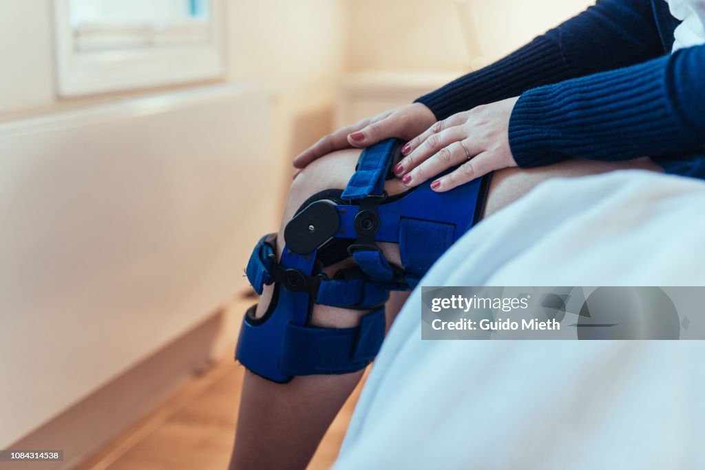 Woman using a knee splint.