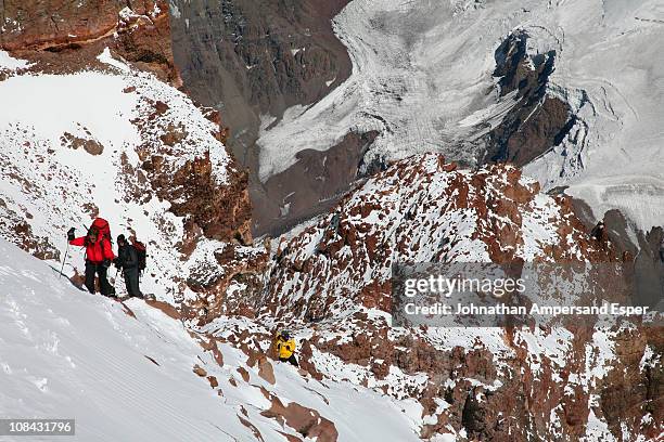 mountaineers at 22,400ft on the upper canaleta near the summit of aconcagua, at around 6800 meters elevation currently, andes mountain, argentina - mount aconcagua stock pictures, royalty-free photos & images