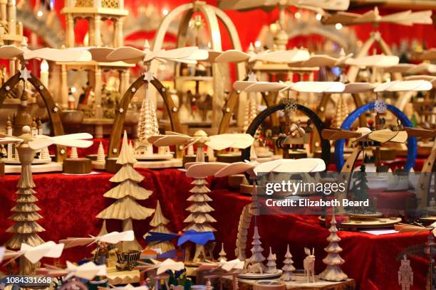 christmas pyramids for sale at a stuttgart christmas market - christmas stuttgart stock pictures, royalty-free photos & images