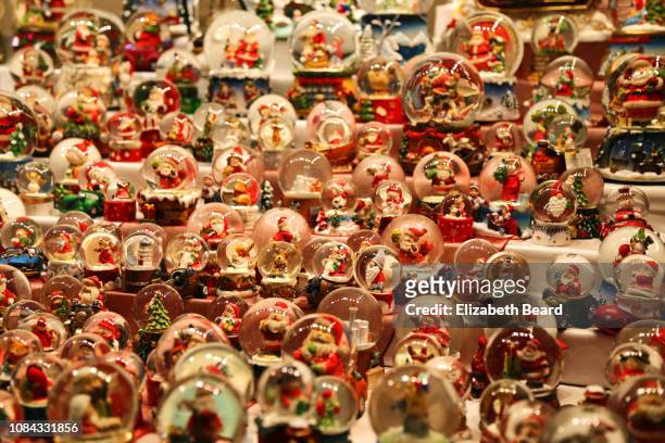 santa claus snow globes for sale at a dusseldorf christmas market - snow globe stock-fotos und bilder