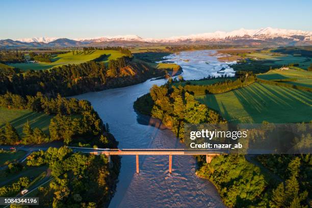 early sunlight over waimakariri river. - canterbury region new zealand stock pictures, royalty-free photos & images