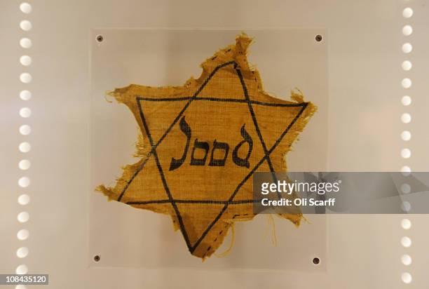 Yellow badge, worn by Jewish man Barnett Greenman in the Jewish Museum's exhibition of Holocaust artifacts, is displayed on Holocaust Memorial Day on...