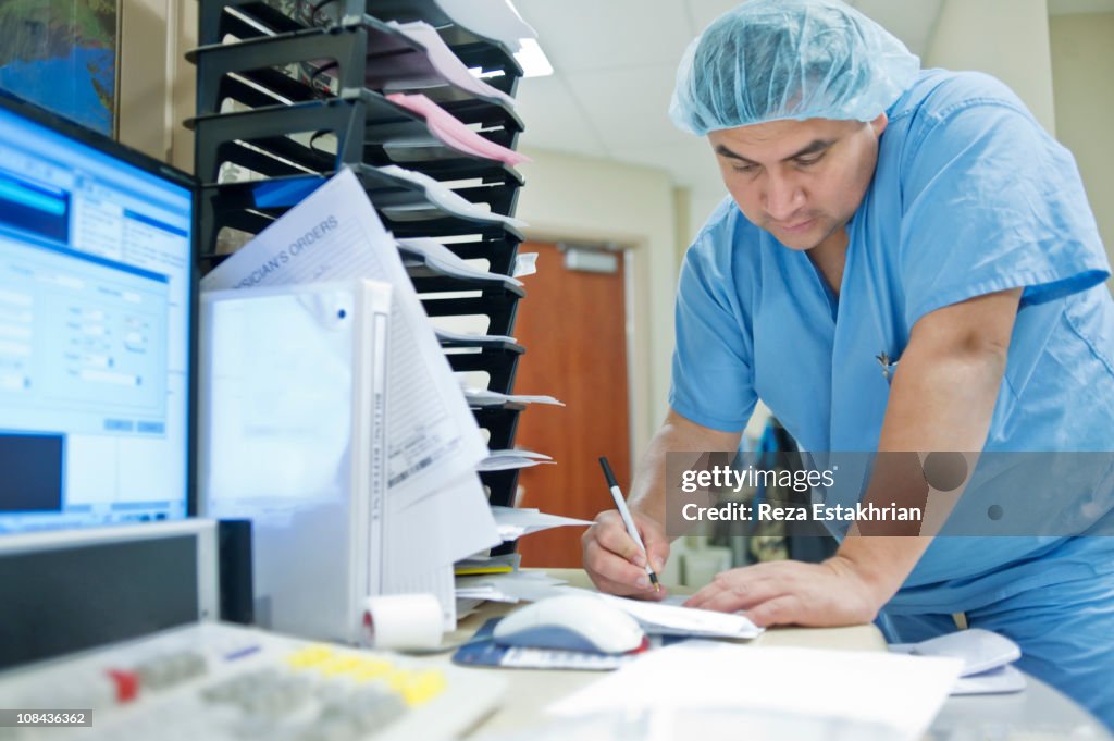 Nurse writes notes