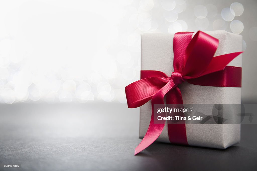 Red Wrapped Rippon Wrapped Gift With Red Ribbon High-Res Stock Photo - Getty Images