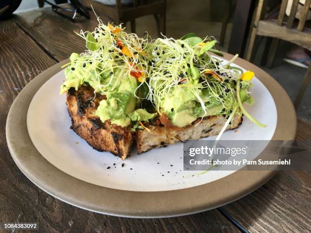 avocado toast - bean sprouts stock pictures, royalty-free photos & images