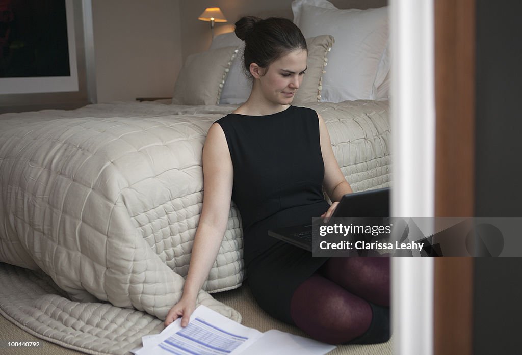 Woman looking at laptop