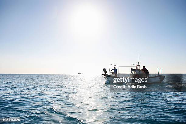 fishermen on fishing boat at sea - fishing ストックフォトと画像