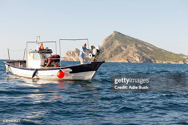 fishermen on fishing boat at sea - trawler stock pictures, royalty-free photos & images