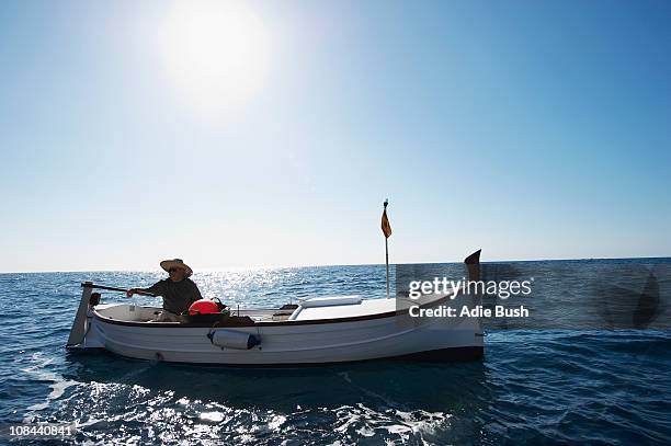 fisherman on fishing boat at sea - altea stockfoto's en -beelden