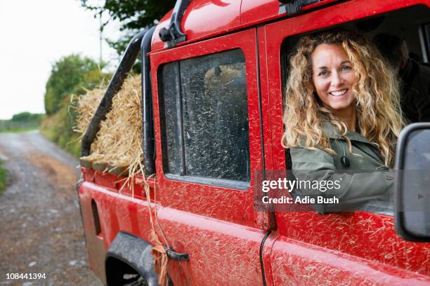 mother driving 4x4 on the farm - single track stock pictures, royalty-free photos & images