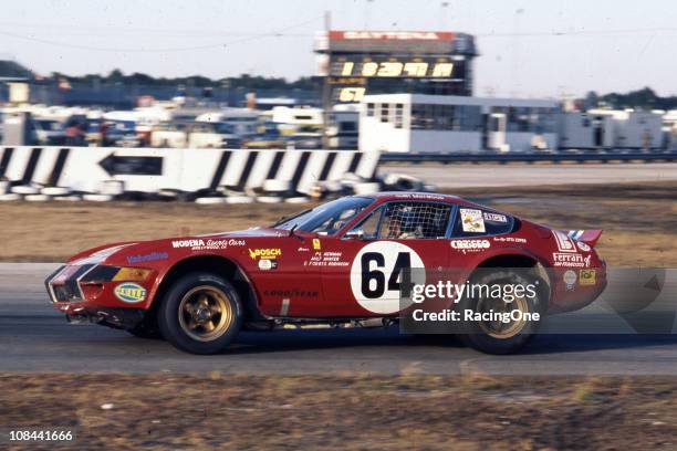 Paul Newman drives his Ferrari 365 GTB/4 Daytona through the infield road course section of the Daytona International Speedway during the 24 Hours of...