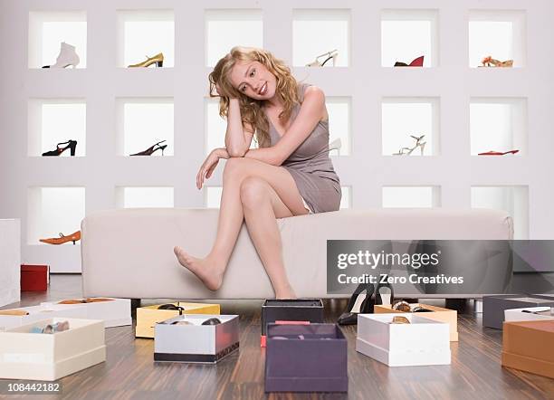 woman in a shoe shop - choosing shoes stock pictures, royalty-free photos & images