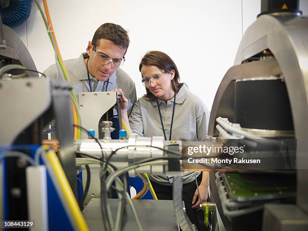 scientists working close up with particle accelerator - physics laboratory stock pictures, royalty-free photos & images