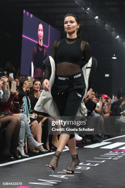 Model Adriana Lima walks the runway at the Maybelline New York show 'Make-up that makes it in New York' during the Berlin Fashion Week Autumn/Winter...
