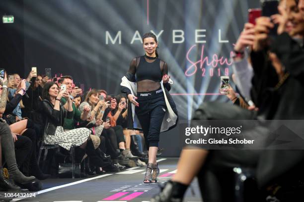 Model Adriana Lima walks the runway at the Maybelline New York show 'Make-up that makes it in New York' during the Berlin Fashion Week Autumn/Winter...