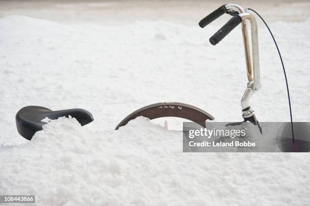 bicycle buried in snow. - inconvenience stock pictures, royalty-free photos & images