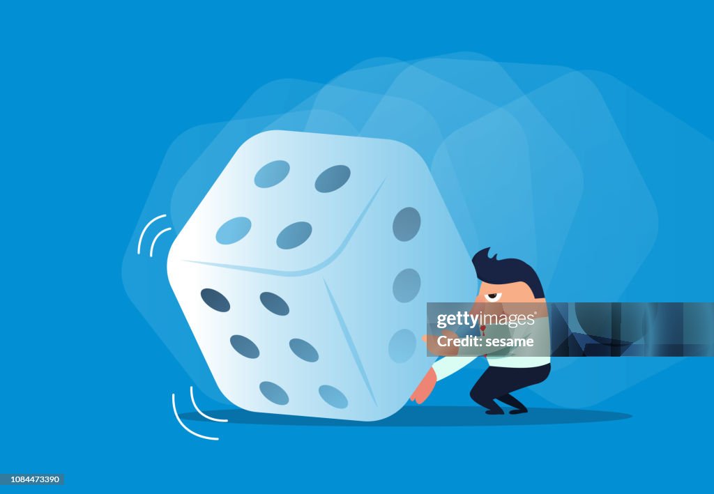 Businessman rolling dice