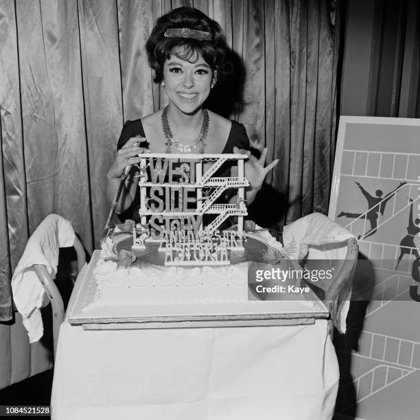 Puerto Rican actress, dancer and singer Rita Moreno with a cake dedicated to 'West Side Story', UK, 25th February 1963.