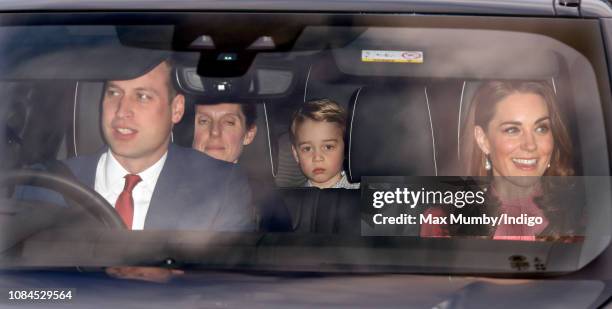 Prince William, Duke of Cambridge, Catherine, Duchess of Cambridge and Prince George of Cambridge attend a Christmas lunch for members of the Royal...