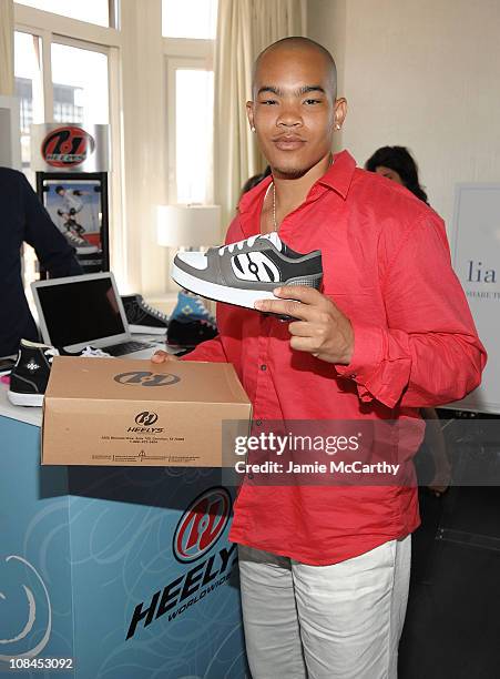 Actor Dewayne Turrentine poses with Heelys at the Lia Sophia Upfront Suite at The London Hotel on May 19, 2009 in New York City.