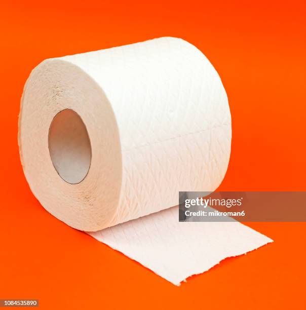 rolls toilet paper. toilet tissue rolls - rolled up stockfoto's en -beelden